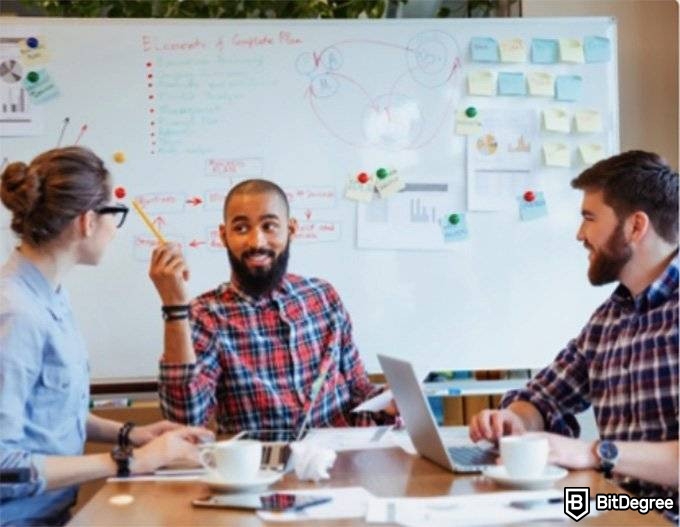 Best Udacity courses: people in a conference room.